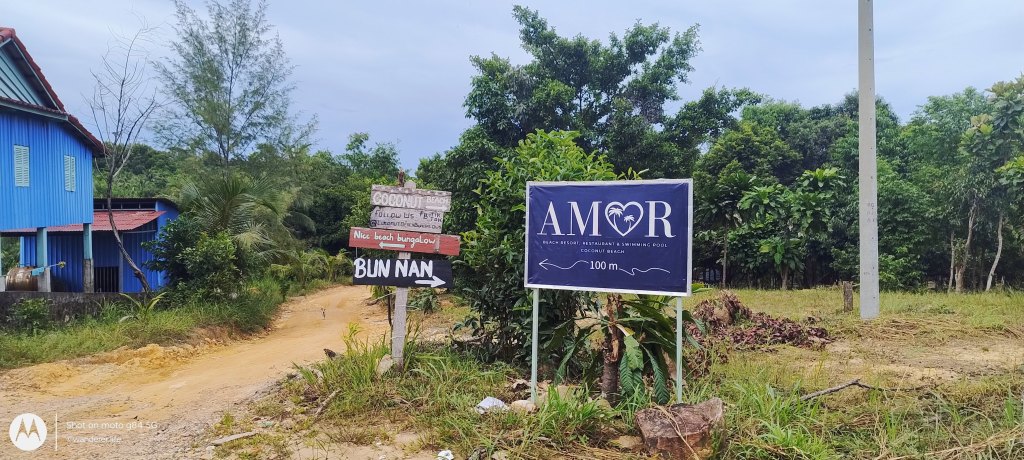 Signboard pointing towards Coconut Beach, koh rong, cambodia